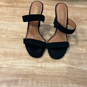 Barely worn. black backless heeled sandals. 4 inch heel. Faux velvet.